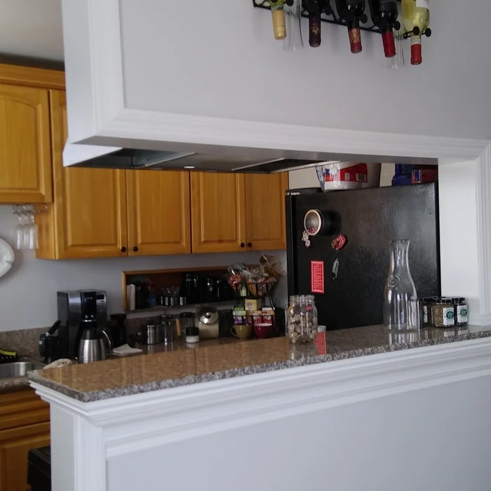Kitchen range hood and cabinetry by Felipe Handyman
